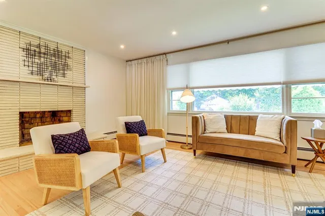 a outdoor living space with furniture and a fireplace