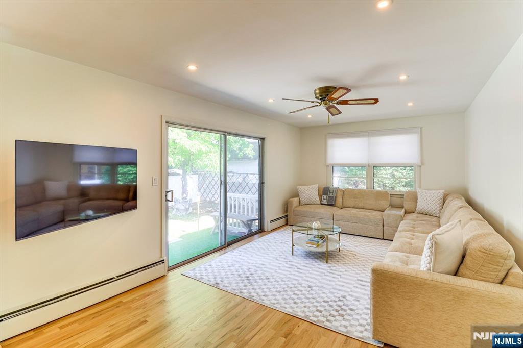213 Haroldson Place Pompton Lakes, NJ 07442 - Photo 10 of 26 a living room with furniture and a flat screen tv