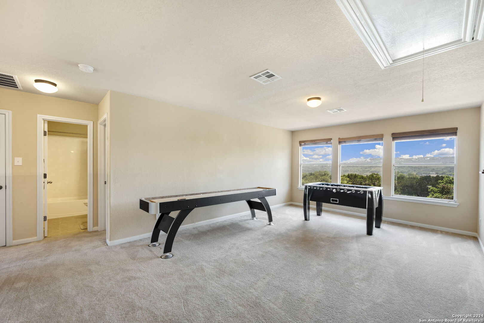 17132 Bandera Road Helotes, TX 78023 - Photo 13 of 39 a view of an empty room with large windows