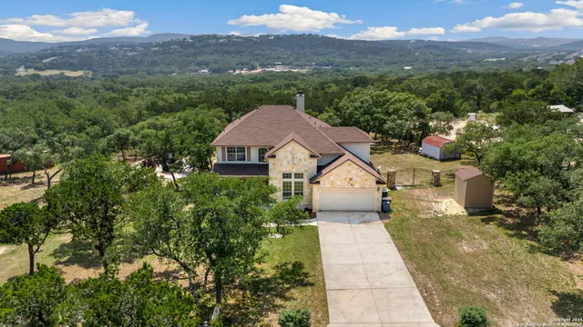a aerial view of a house with a yard