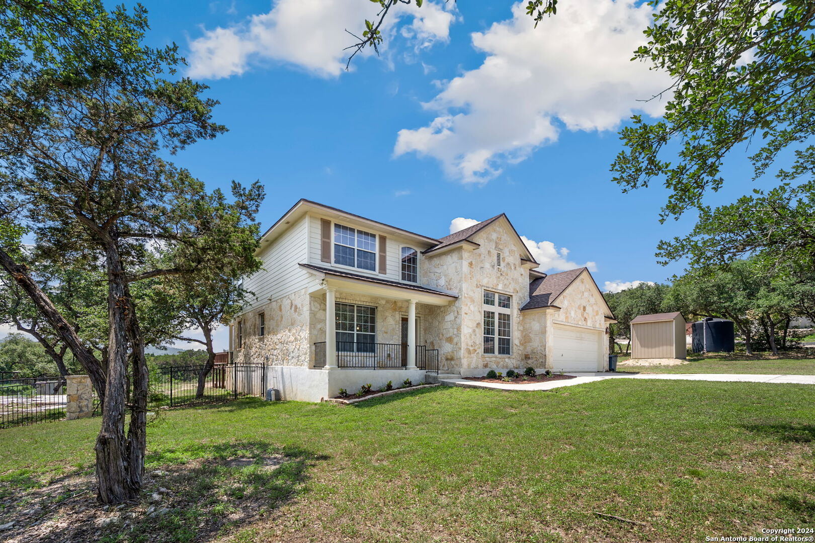 17132 Bandera Road Helotes, TX 78023 - Photo 29 of 39 a view of a house with a yard