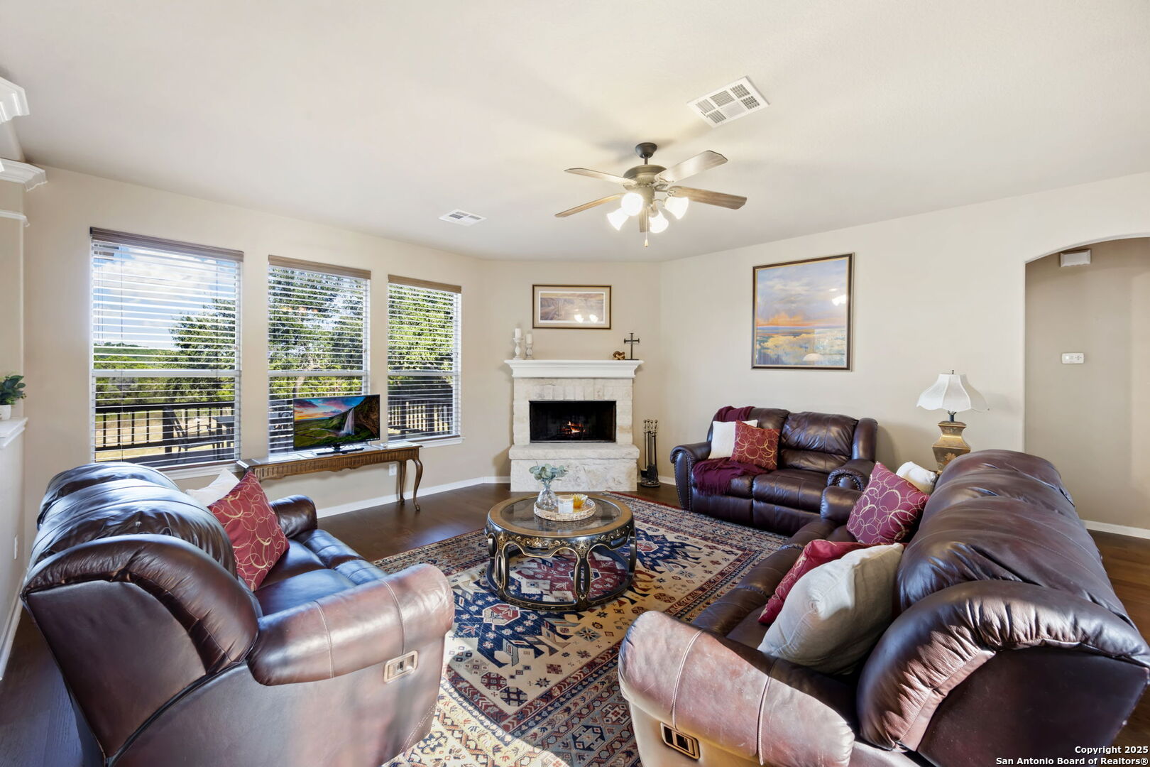 17132 Bandera Road Helotes, TX 78023 - Photo 32 of 39 a living room with furniture and a fireplace