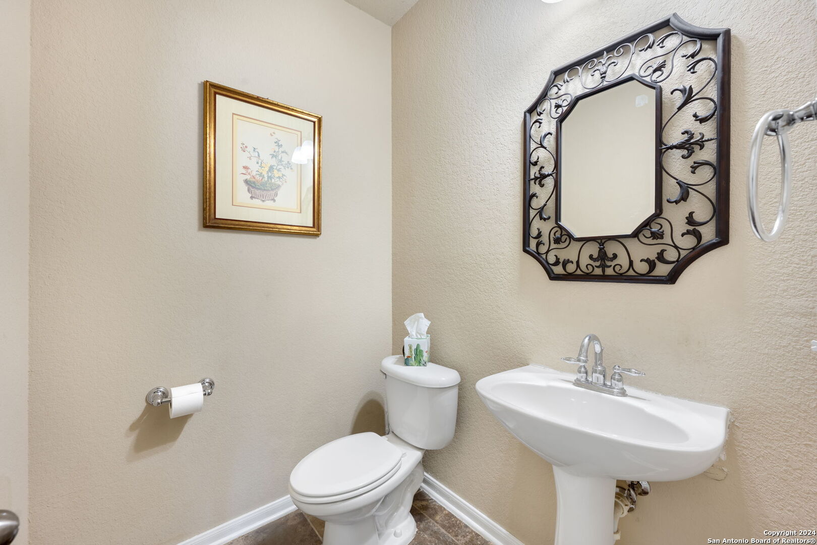 17132 Bandera Road Helotes, TX 78023 - Photo 34 of 39 a bathroom with a toilet sink and mirror