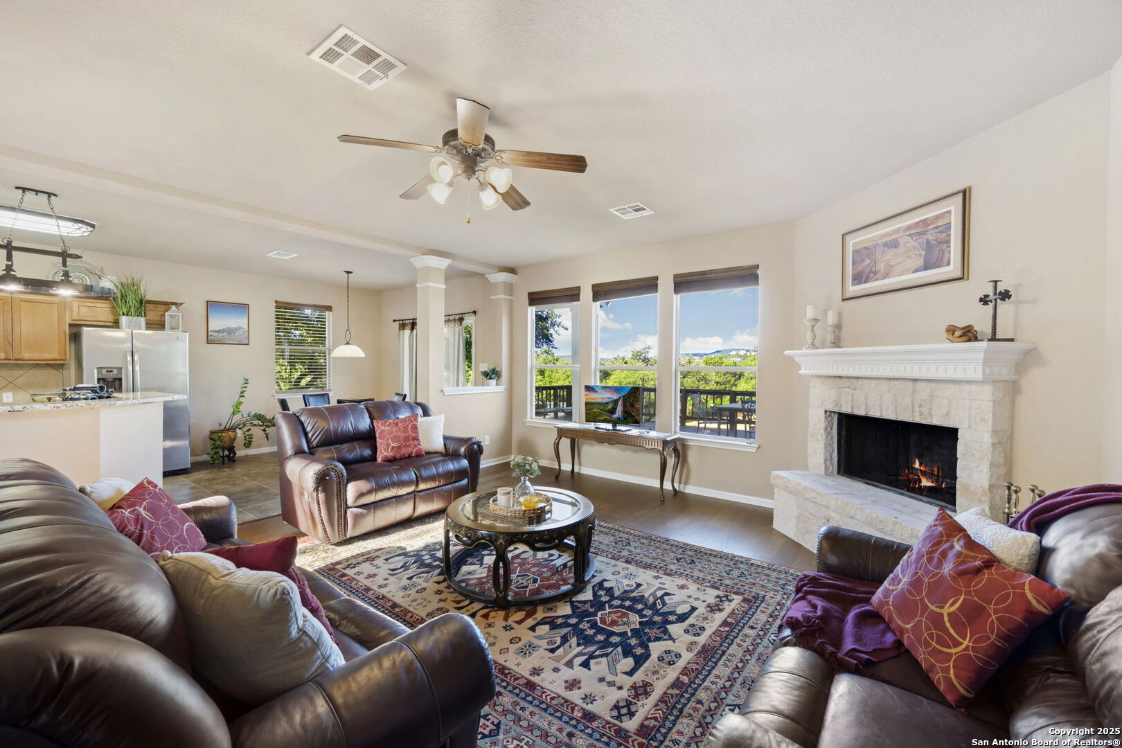 17132 Bandera Road Helotes, TX 78023 - Photo 6 of 39 a living room with furniture and a fireplace
