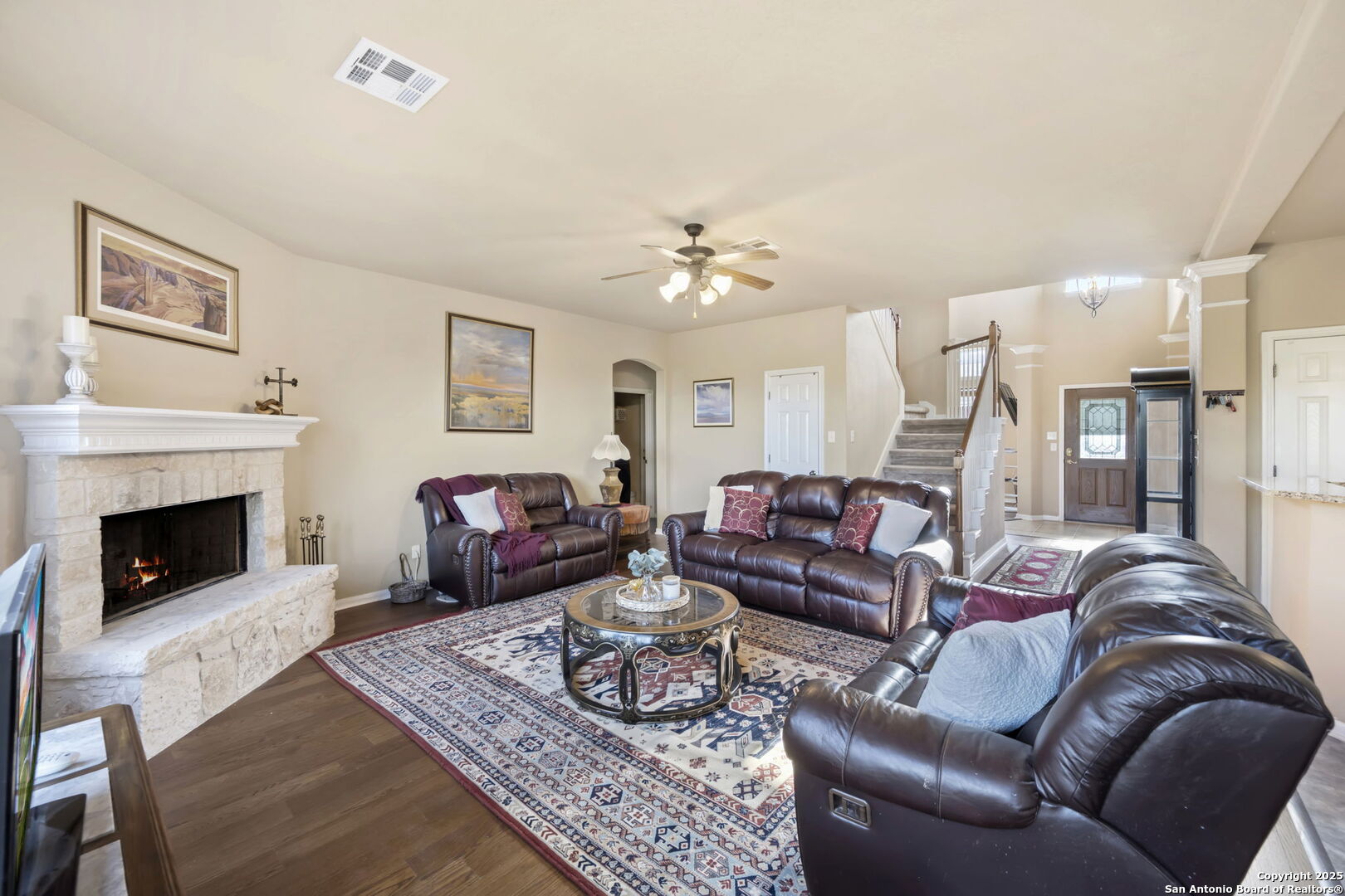 17132 Bandera Road Helotes, TX 78023 - Photo 7 of 39 a living room with furniture and a fireplace