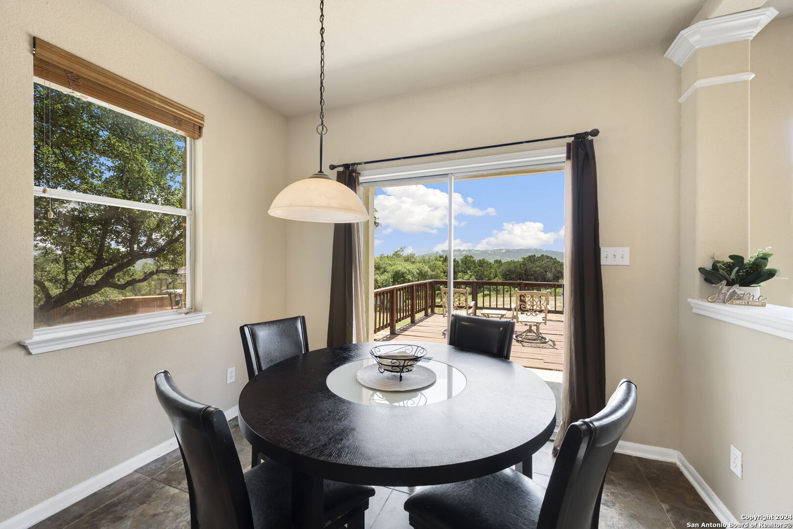 17132 Bandera Road Helotes, TX 78023 - Photo 10 of 39 a view of a dining room with furniture window and outside view