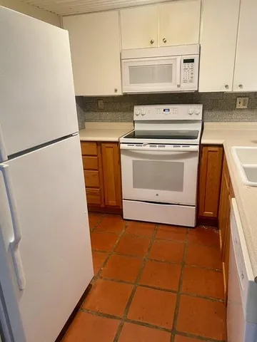 a view of a bathroom with a sink and a mirror
