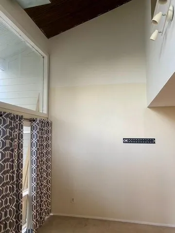 a bathroom with a window and a shower