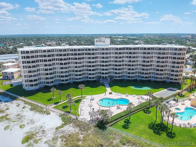 a view of a swimming pool with a garden