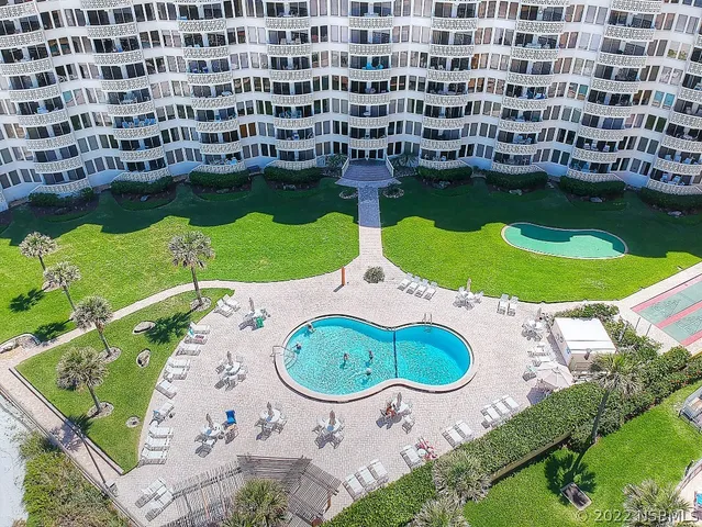 an aerial view of a swimming pool and outdoor space