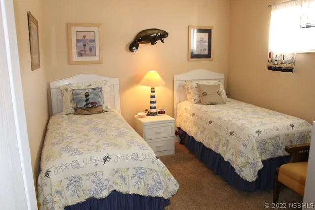 a bedroom with bed and a window