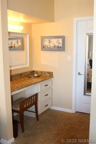a view of cabinets with wooden floor and dining table