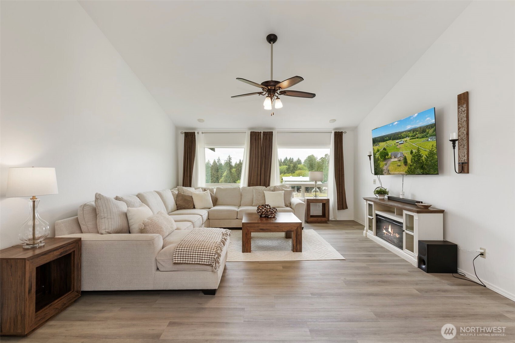 14110 Glenwood Road Southwest Port Orchard, WA 98367 - Photo 5 of 40 a living room with furniture flat screen tv and wooden floor