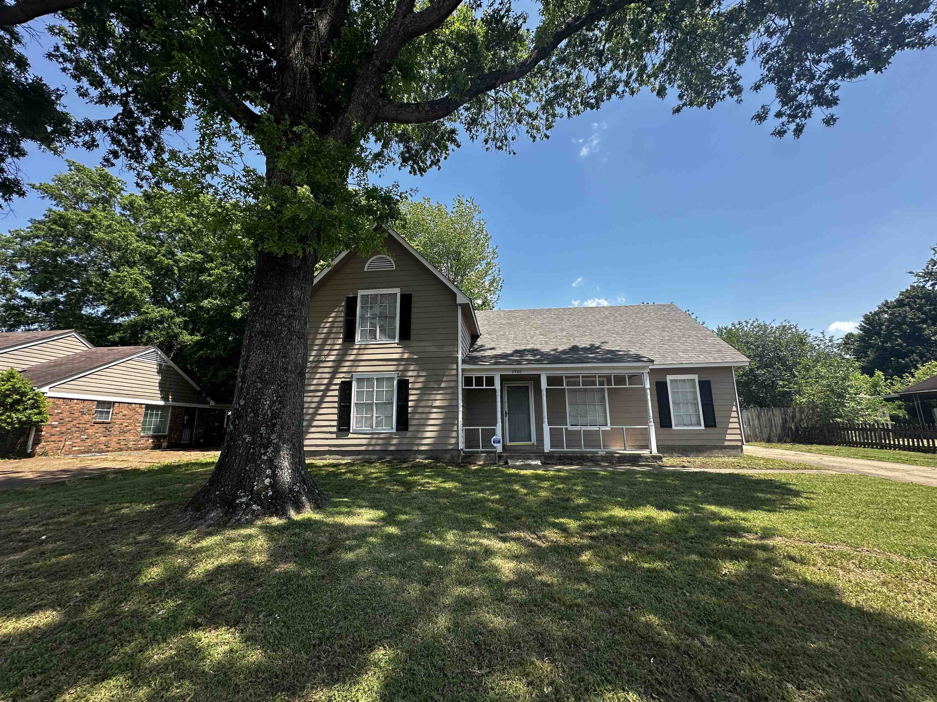 2980 Ridgeway Road Memphis, TN 38115 - Photo 1 of 7 a front view of a house with a garden