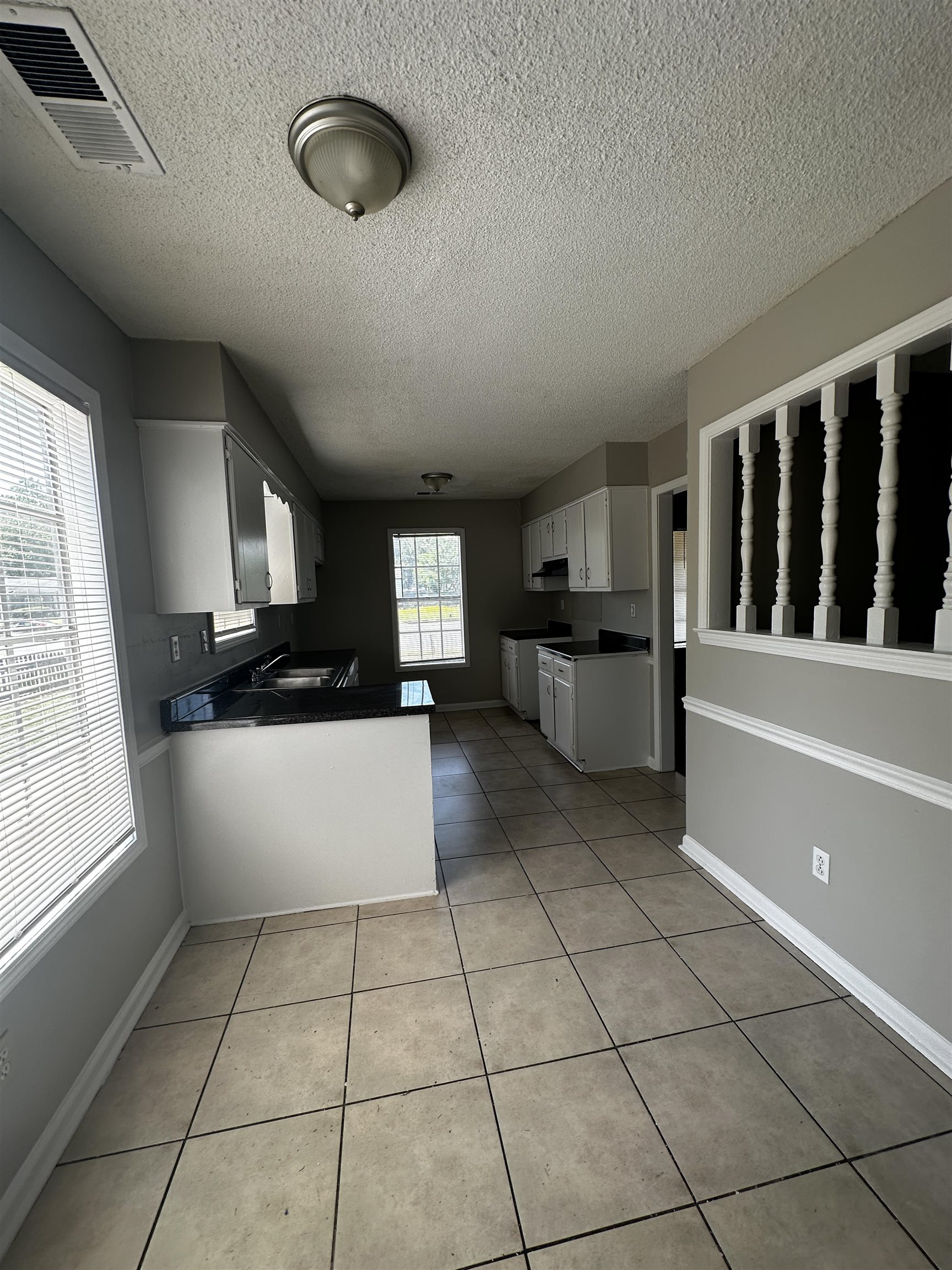 2980 Ridgeway Road Memphis, TN 38115 - Photo 4 of 7 a kitchen with a cabinets and white appliances