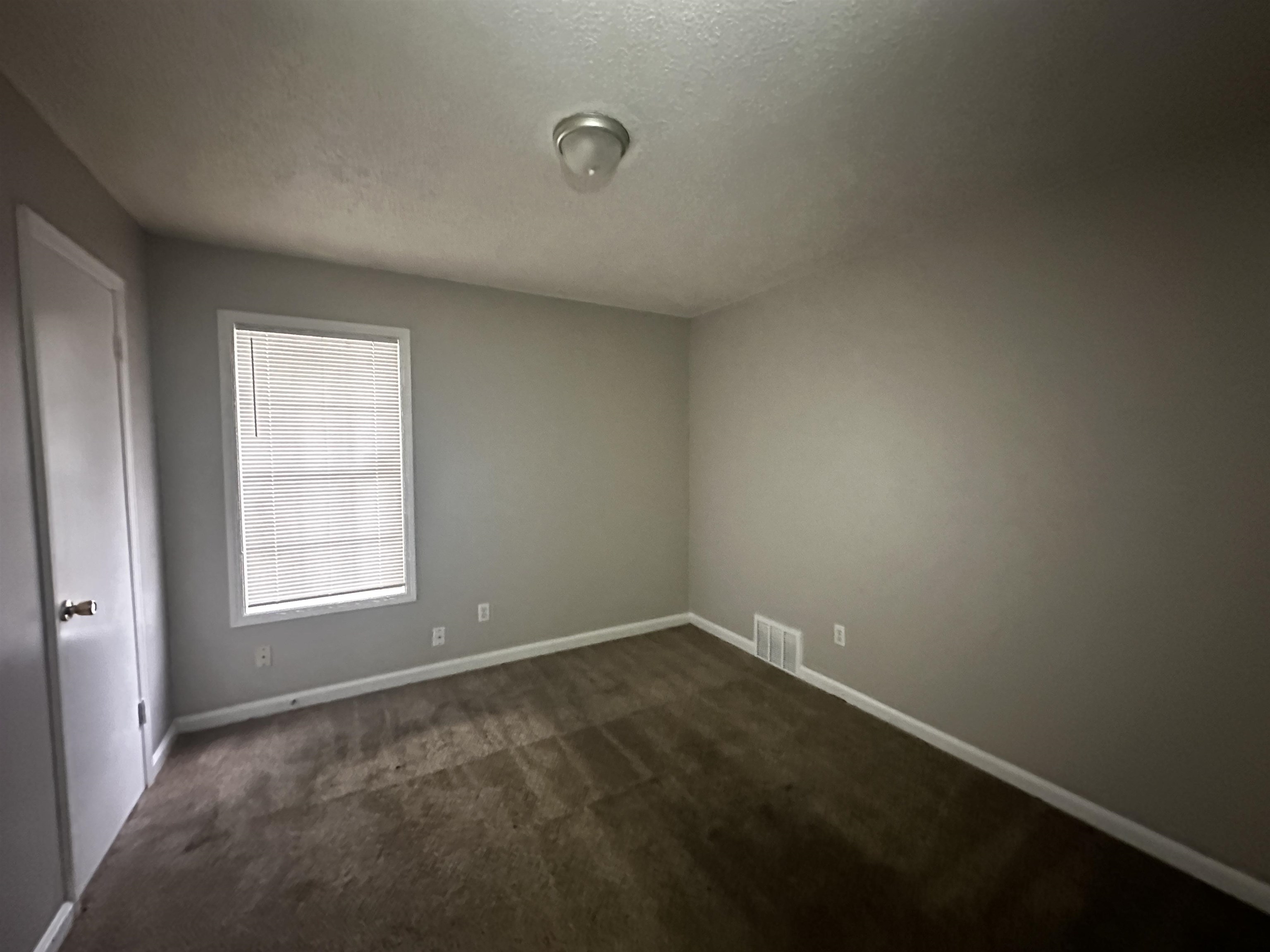 2980 Ridgeway Road Memphis, TN 38115 - Photo 5 of 7 an empty room with a window