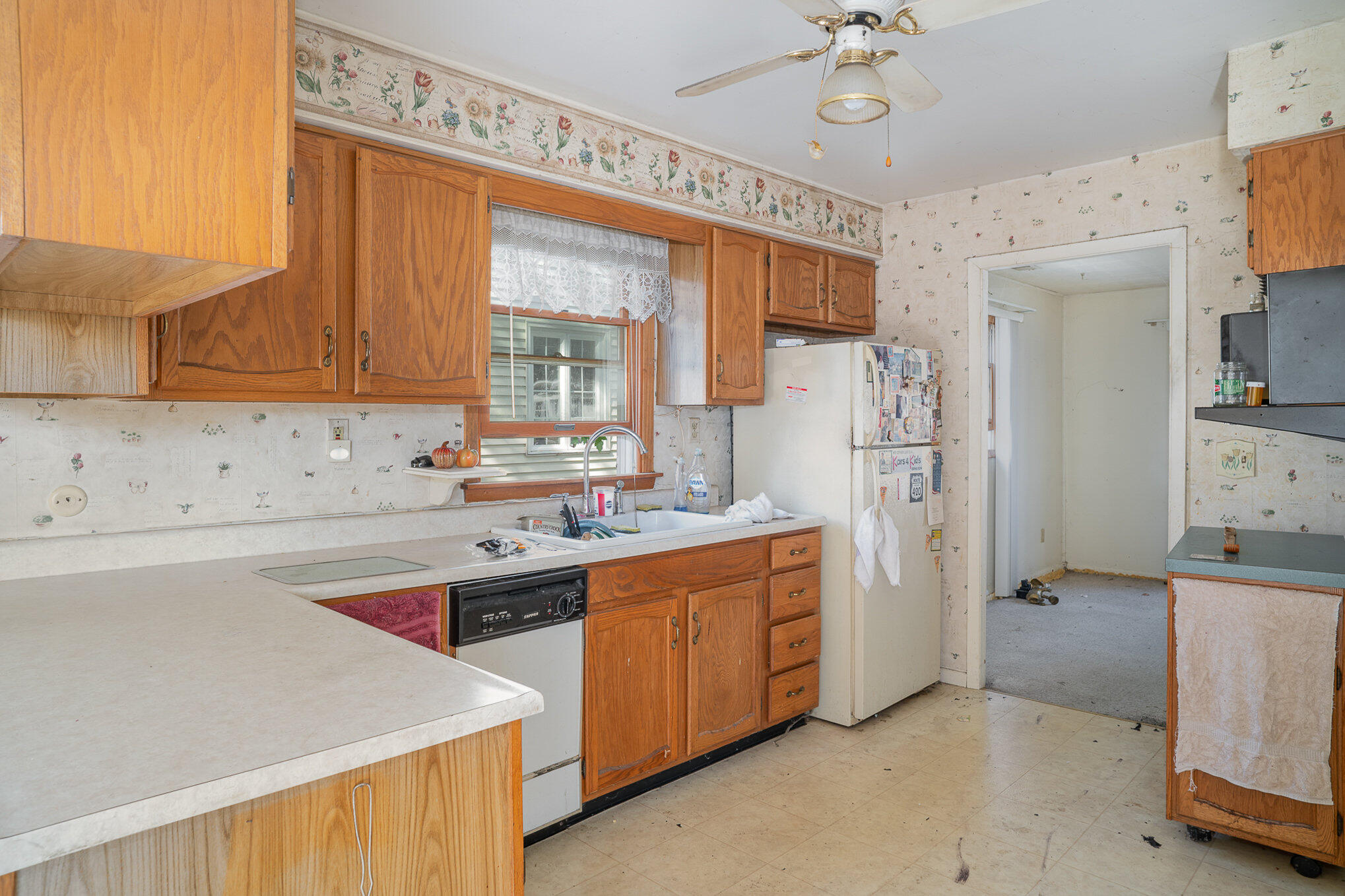 737 Center Street Crown Point, IN 46307 - Photo 3 of 10 a kitchen with stainless steel appliances a stove a refrigerator and a sink