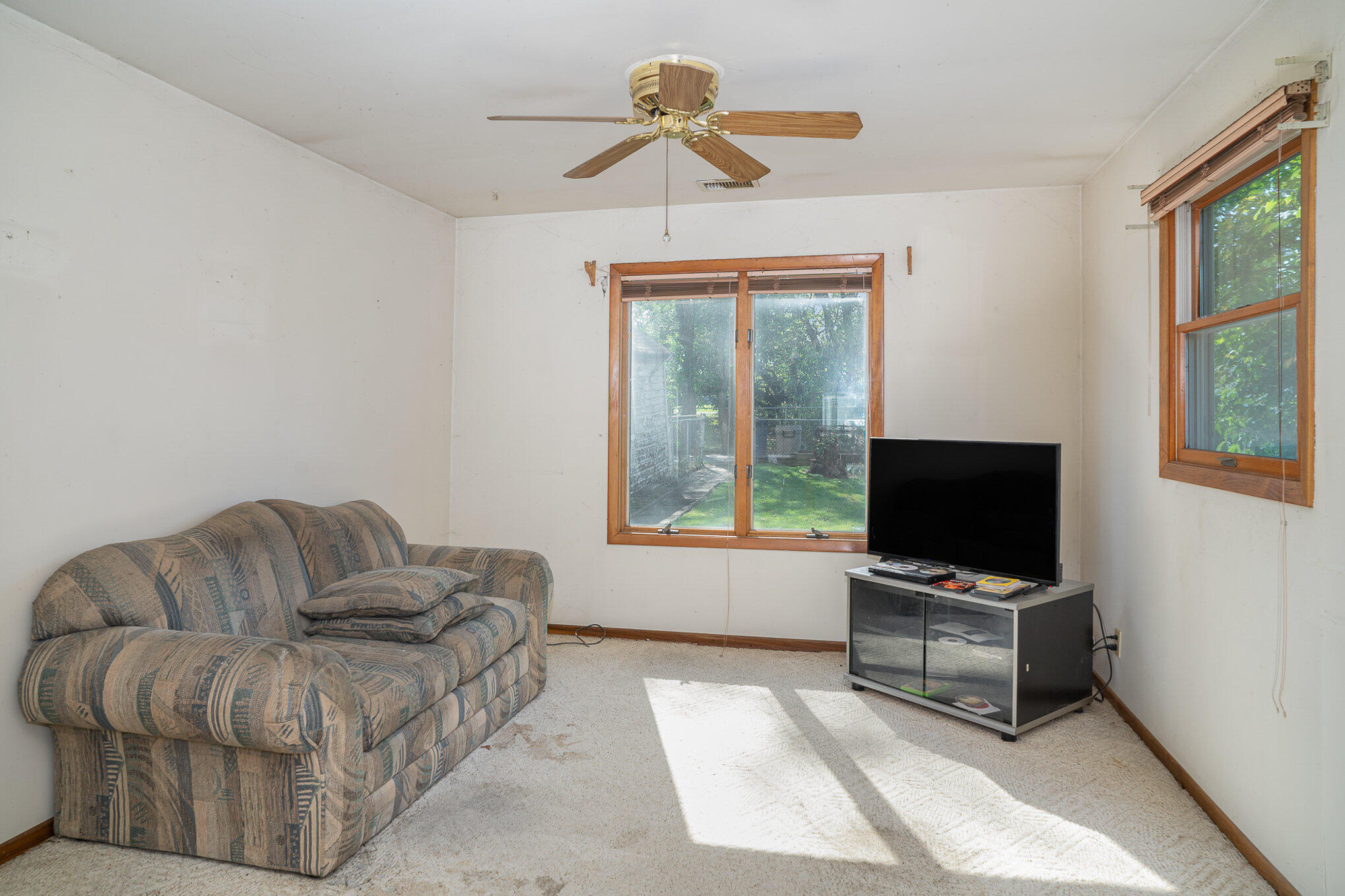 737 Center Street Crown Point, IN 46307 - Photo 5 of 10 a living room with furniture and a flat screen tv