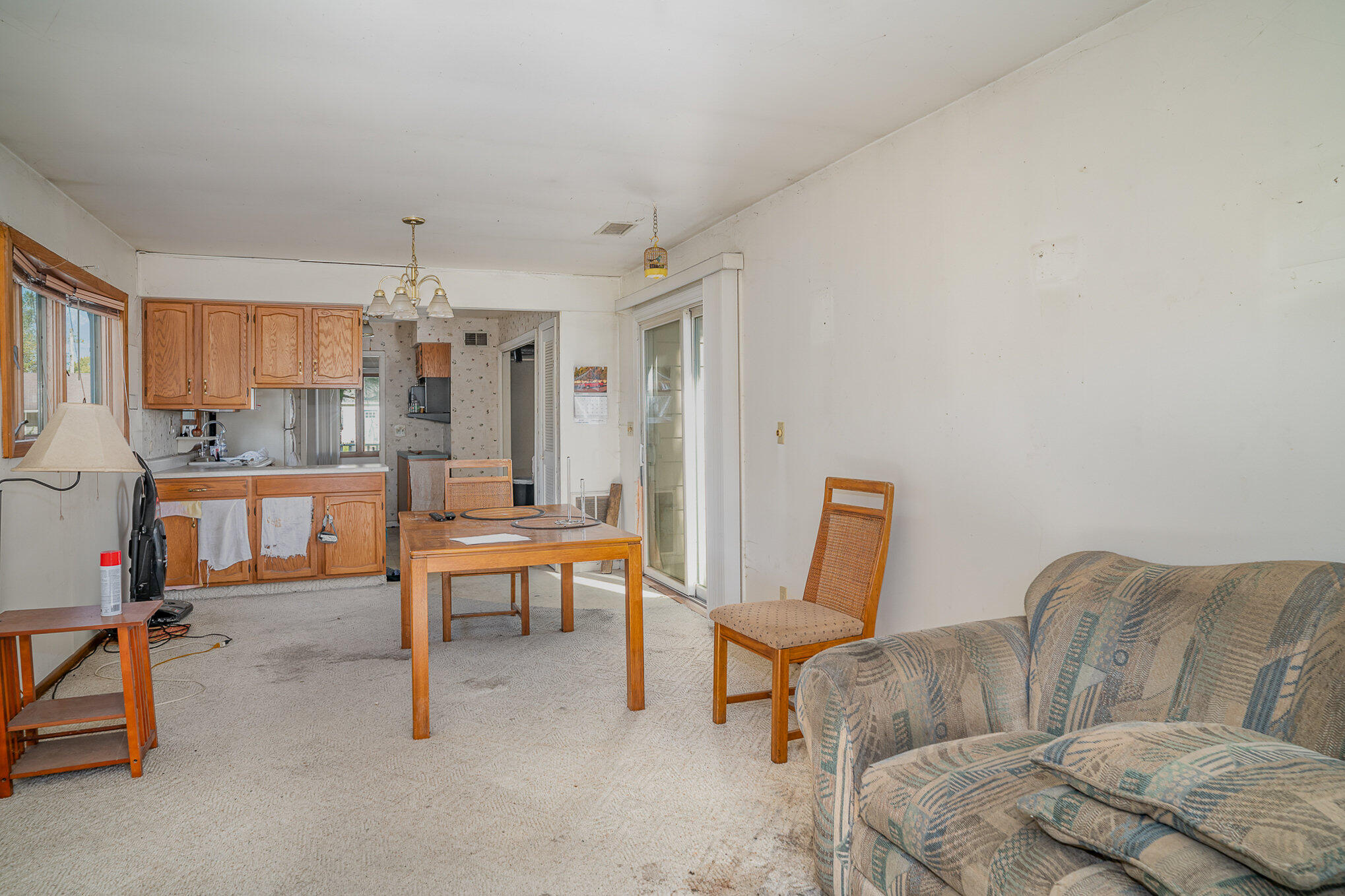 737 Center Street Crown Point, IN 46307 - Photo 6 of 10 a living room with furniture and a dining table with kitchen appliances