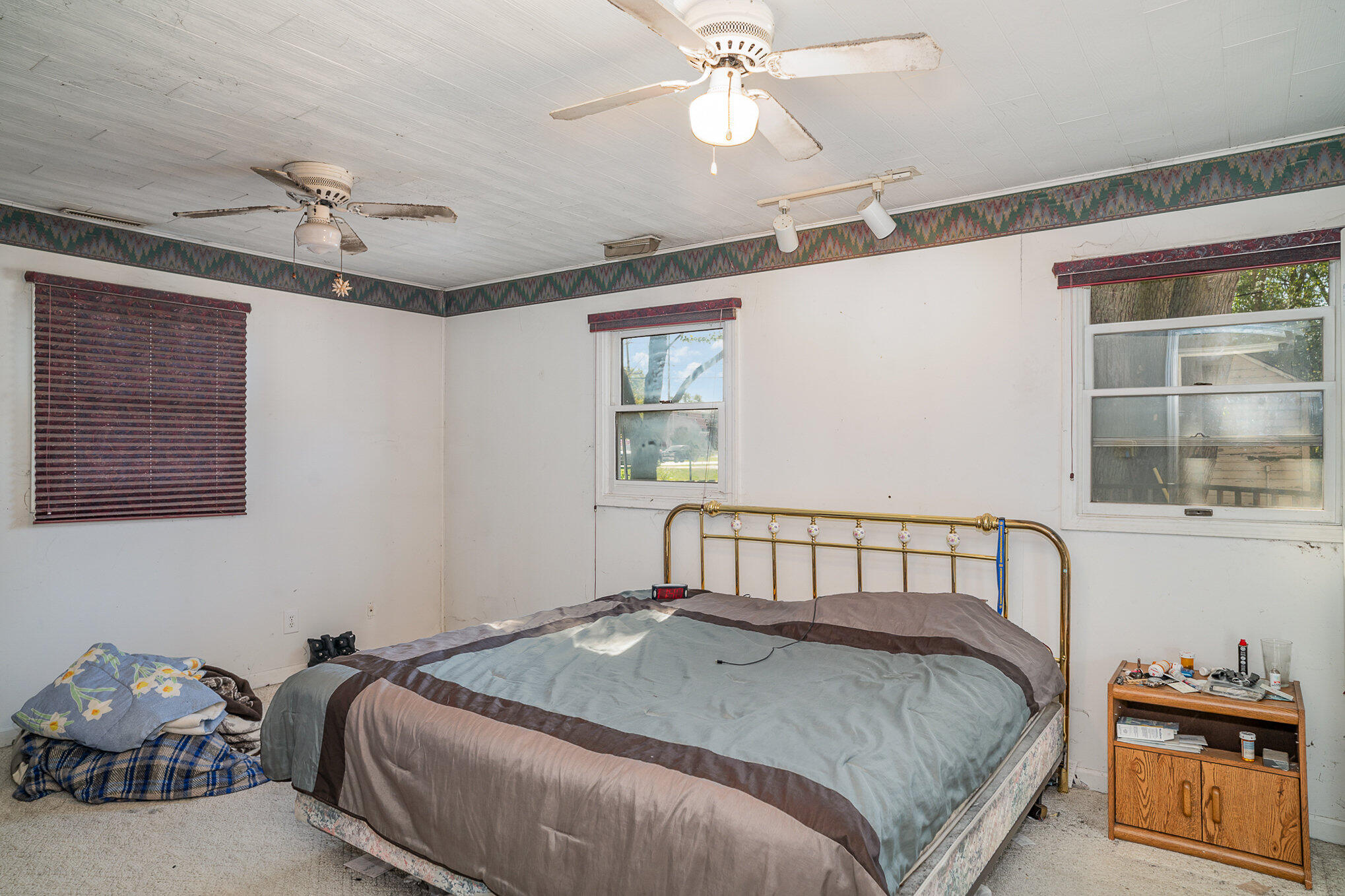 737 Center Street Crown Point, IN 46307 - Photo 8 of 10 a bedroom with a bed and a window