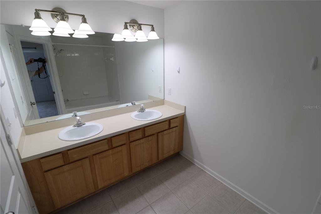 4866 Pond Ridge Drive Riverview, FL 33578 - Photo 28 of 38 a bathroom with a sink and a mirror