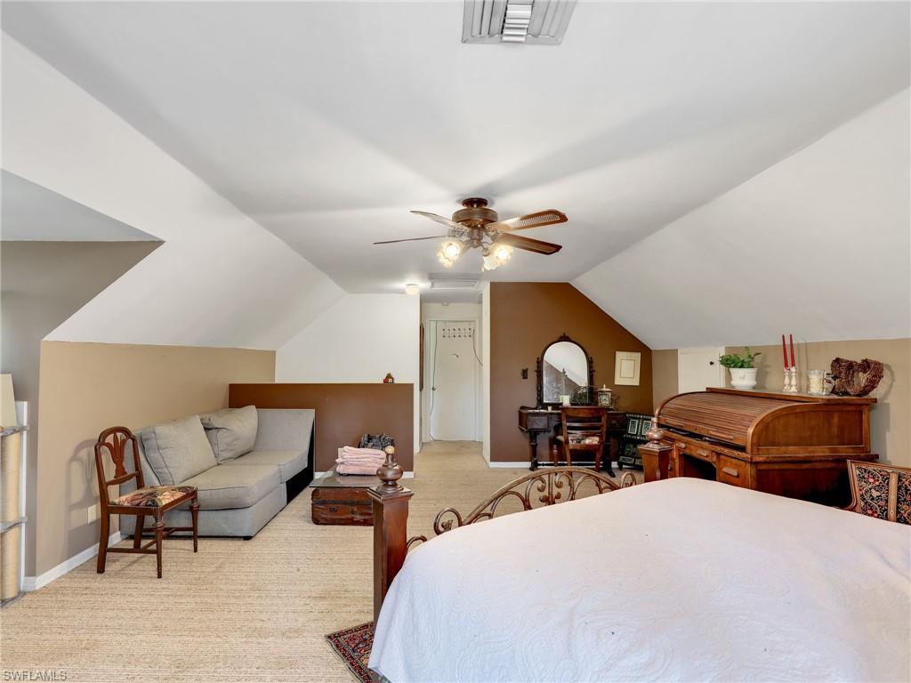 210 25th Street Southwest Naples, FL 34117 - Photo 21 of 33 Bedroom featuring lofted ceiling, light colored carpet, and ceiling fan