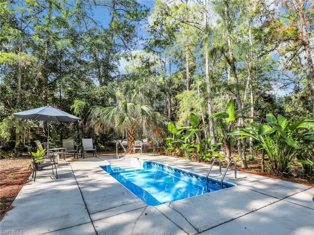 210 25th Street Southwest Naples, FL 34117 - Photo 26 of 33 Swimming pool featuring a patio