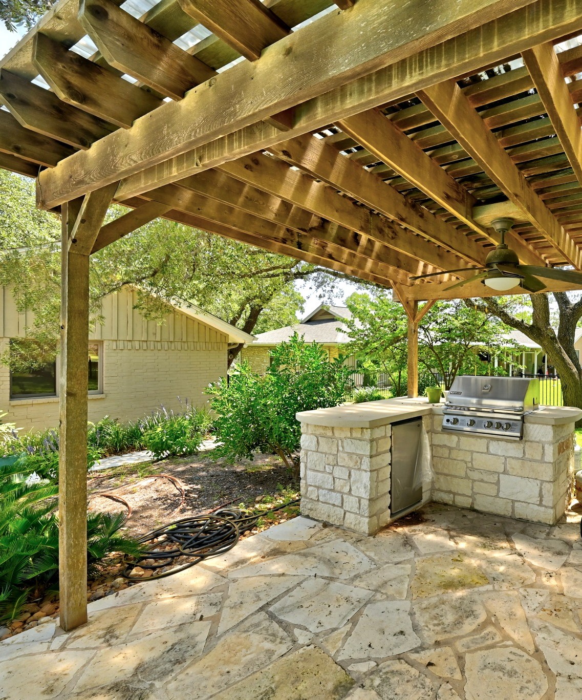 8608 Crest Ridge Circle Austin, TX 78750 - Photo 32 of 38 An inviting outdoor kitchen area with a built-in grill offers seamless entertaining.