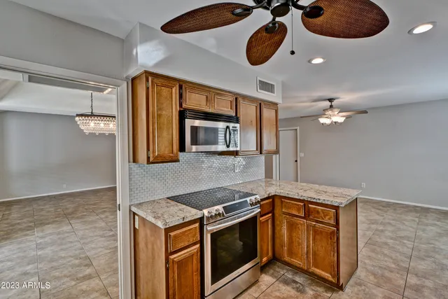 a kitchen with a stove and a microwave