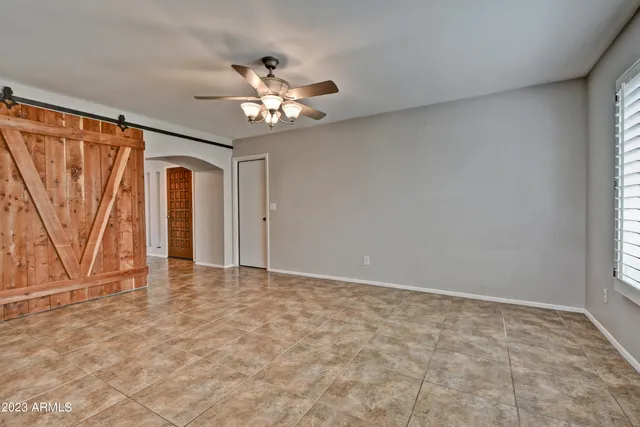 a view of an empty room with a window