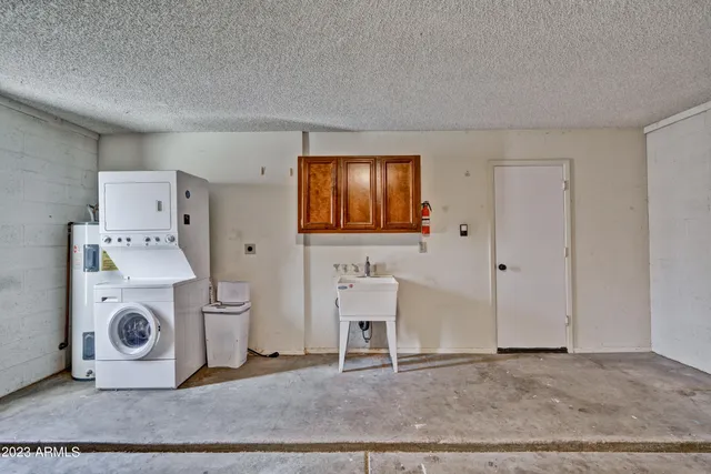 a view of livingroom with washer and dryer