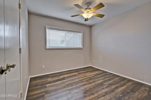 a view of a room with a fan and a fan