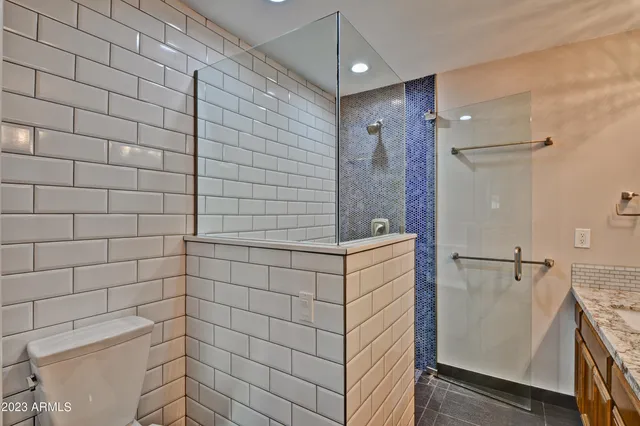 a bathroom with a shower and a sink