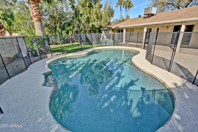 a view of a swimming pool with a patio