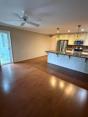 a view of an empty room with a window