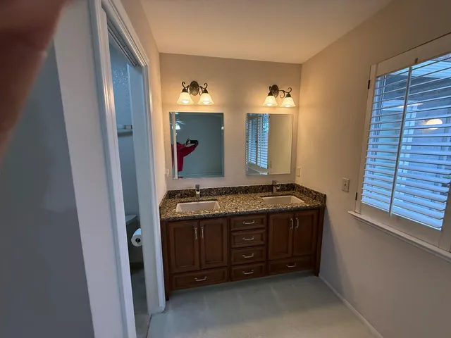 an aerial view of residential houses with outdoor seating