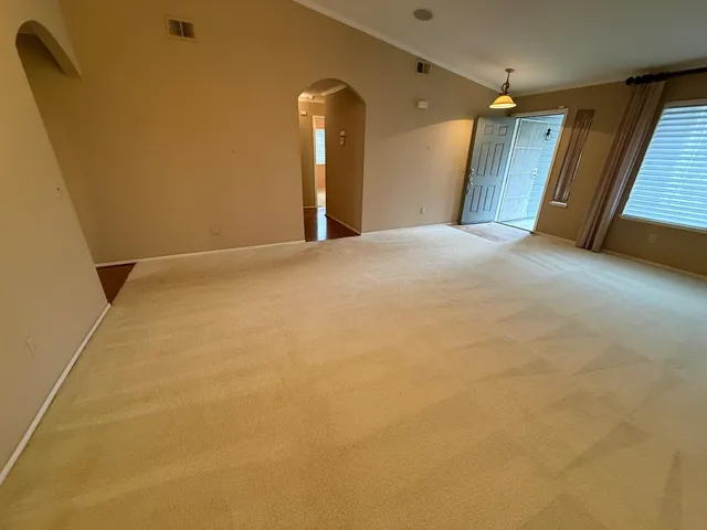 a kitchen with stainless steel appliances granite countertop refrigerator a sink and a stove