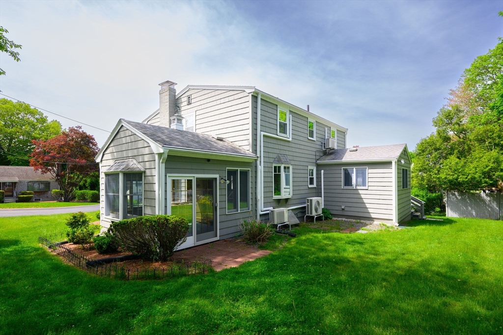 40 Bell Road Weymouth, MA 02188 - Photo 4 of 41 a view of a house with a yard and sitting area