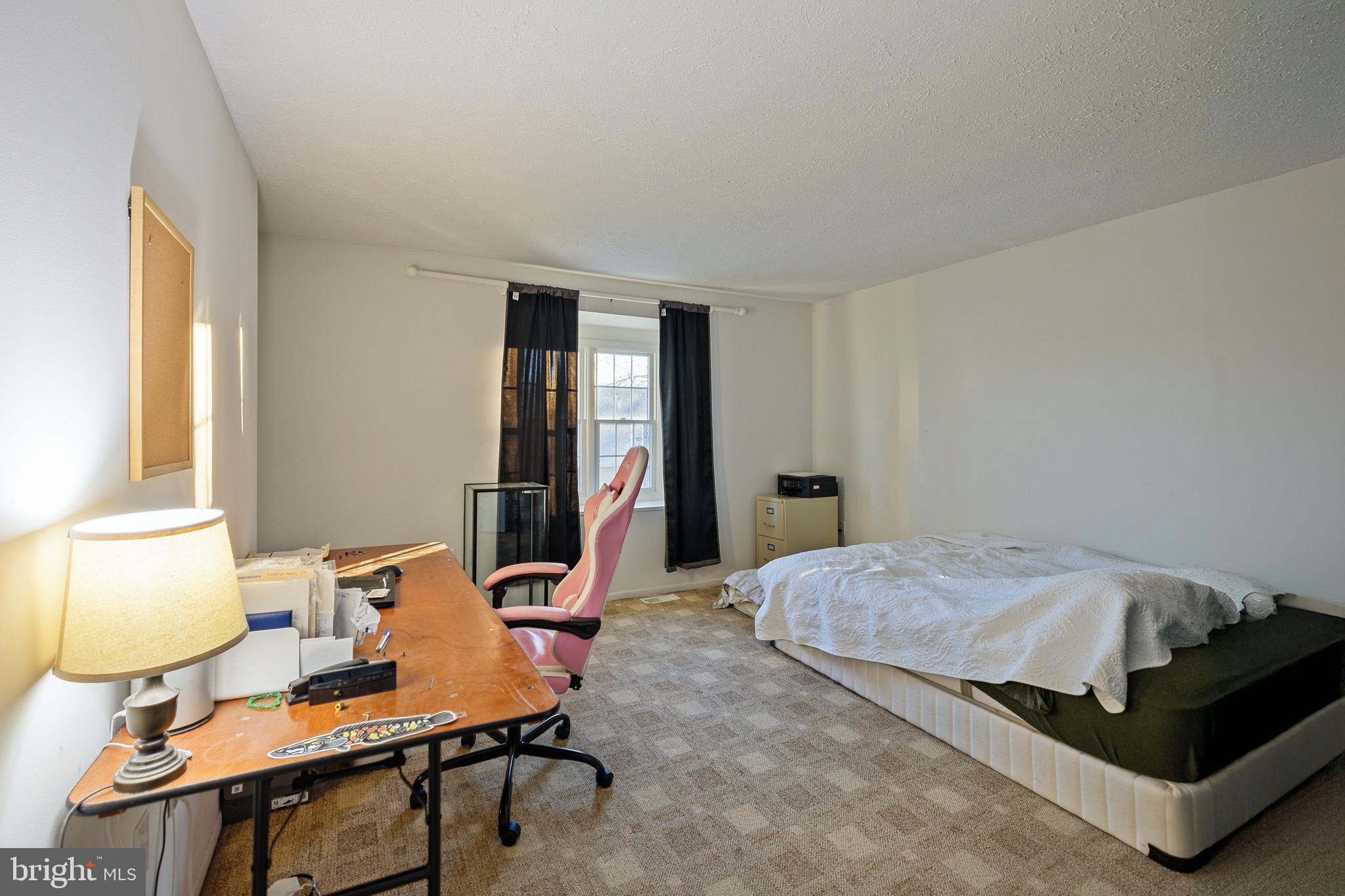 732 Winton Avenue Glen Burnie, MD 21061 - Photo 18 of 27 a bedroom with a bed and large windows