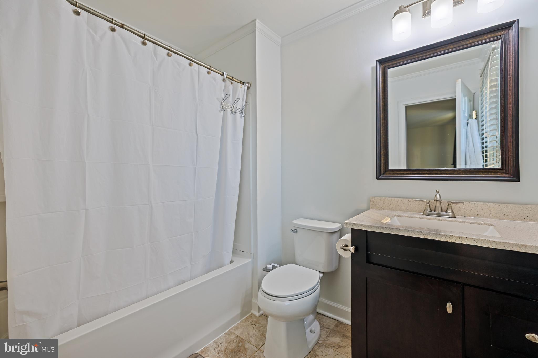 732 Winton Avenue Glen Burnie, MD 21061 - Photo 20 of 27 a bathroom with a toilet a sink and a mirror