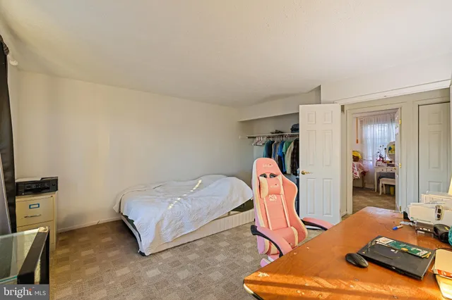 a bedroom with furniture and a gym equipment