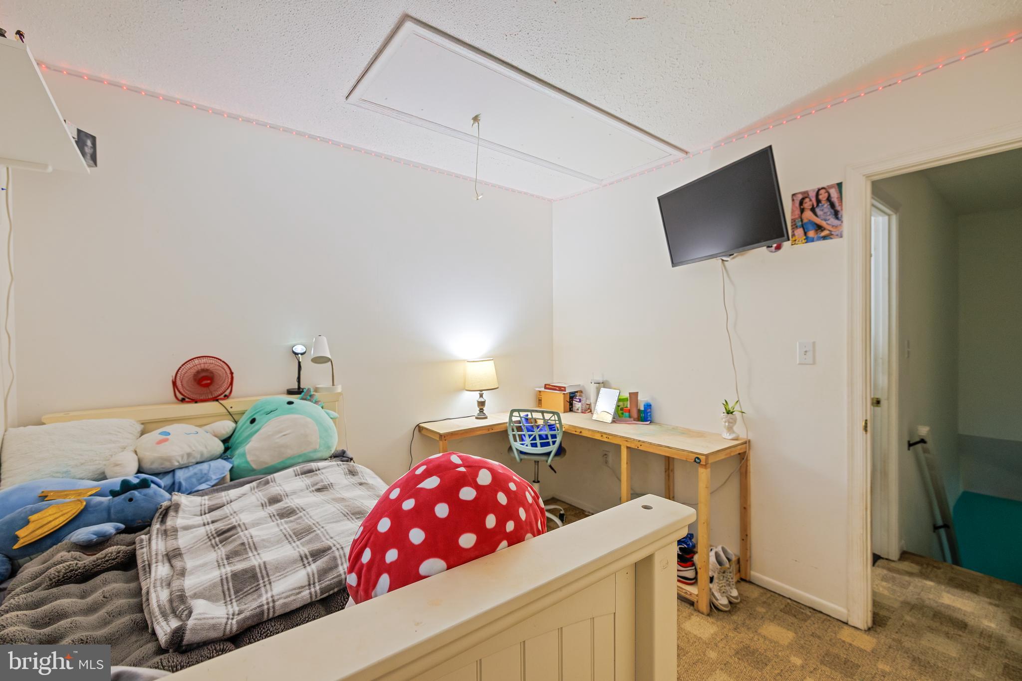 732 Winton Avenue Glen Burnie, MD 21061 - Photo 23 of 27 a bedroom with furniture and a flat screen tv