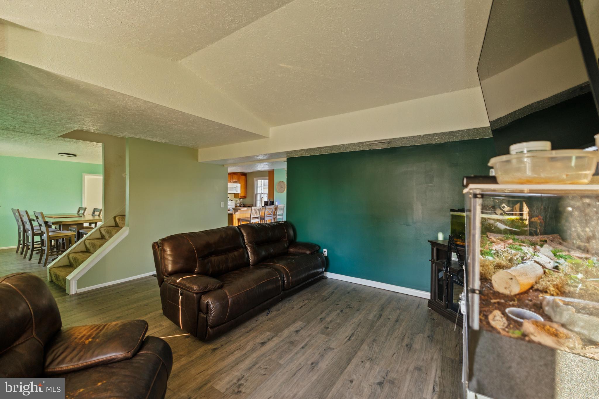 732 Winton Avenue Glen Burnie, MD 21061 - Photo 4 of 27 a living room with furniture and a wooden floor