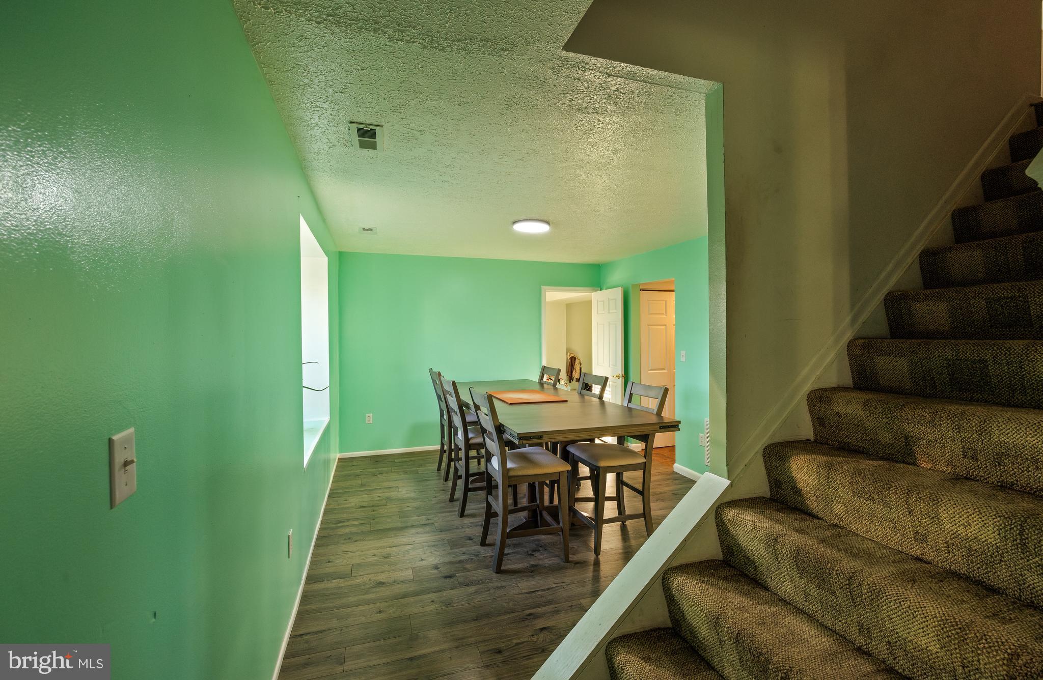 732 Winton Avenue Glen Burnie, MD 21061 - Photo 5 of 27 a view of a dining room with furniture and a potted plant