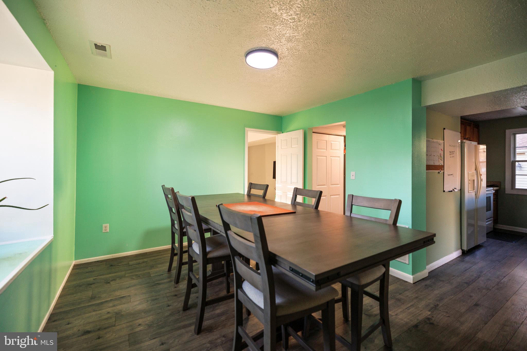 732 Winton Avenue Glen Burnie, MD 21061 - Photo 6 of 27 a view of a dining room with furniture and wooden floor