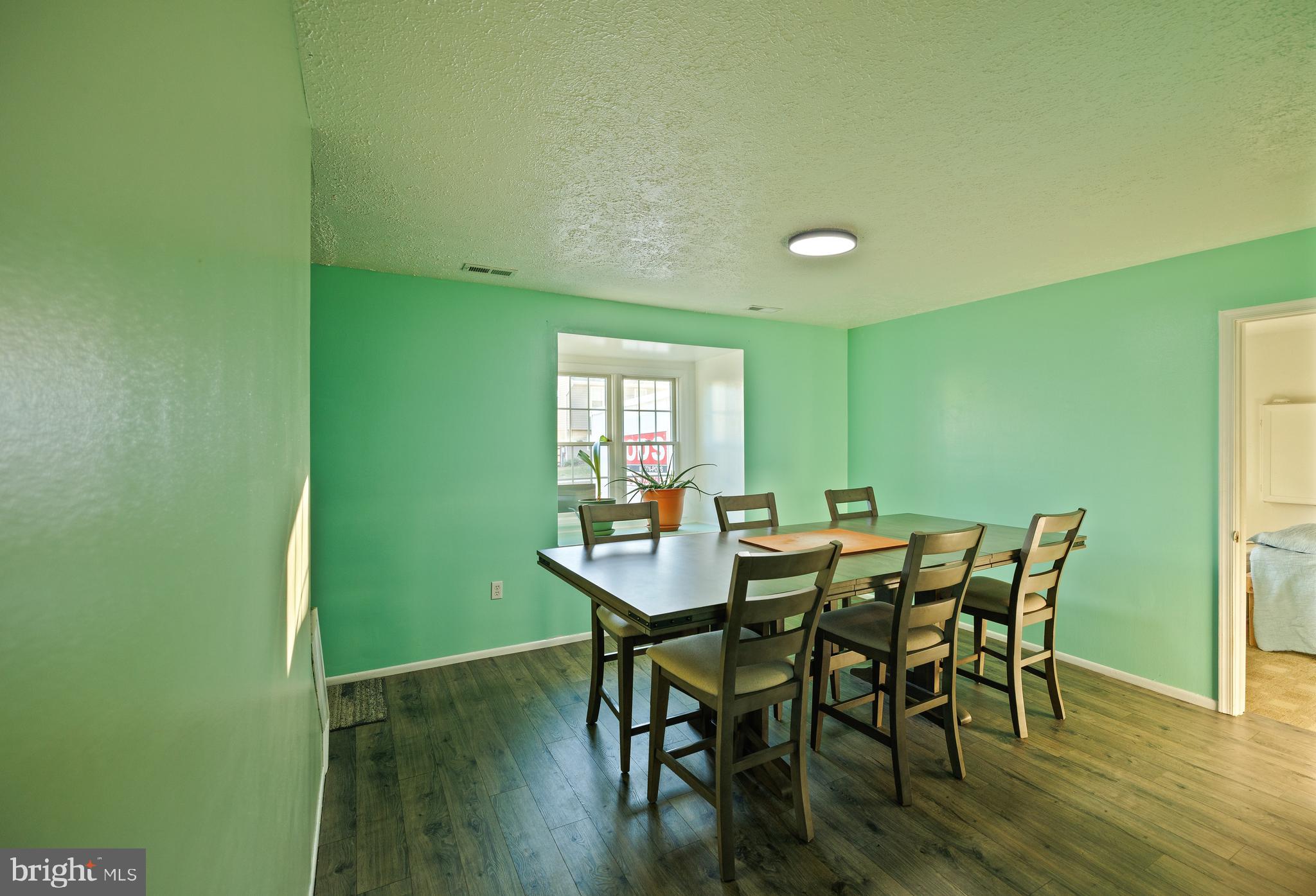 732 Winton Avenue Glen Burnie, MD 21061 - Photo 7 of 27 a view of a dining room with furniture and wooden floor