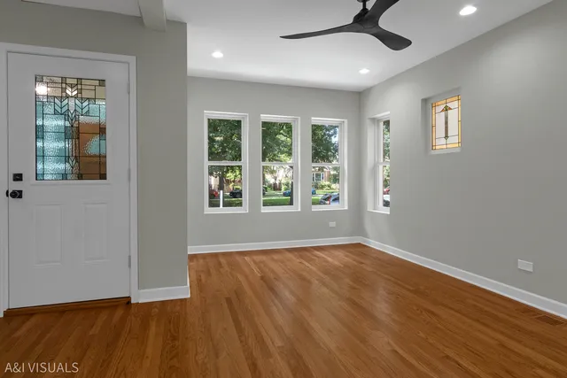 a view of a hallway with windows
