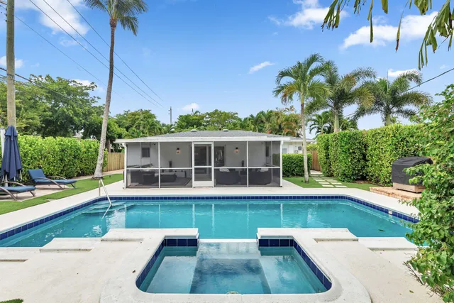 a view of a swimming pool with a patio