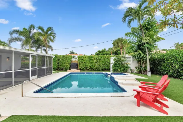 a view of swimming pool with chairs