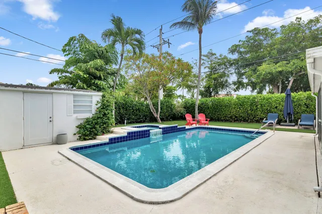 a view of a swimming pool with a patio